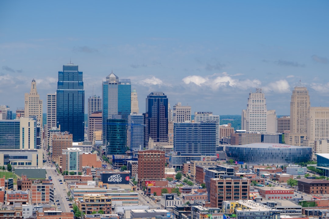 Kansas city skyline featuring modern skyscrapers and a domed building.