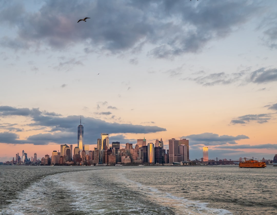 a large body of water with a city in the background